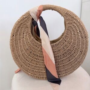 Madison West | Natural Woven Round Straw Tote with Pink & Black Scarf